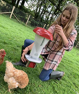 Girl with Rat Proof Feeder